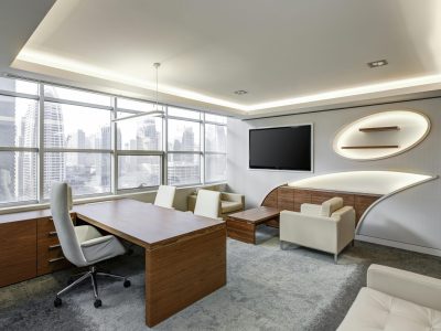 Sleek office space featuring contemporary furniture and city skyline views, ideal for professionals.